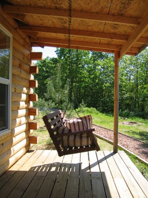 Plymouth cabin porch swing